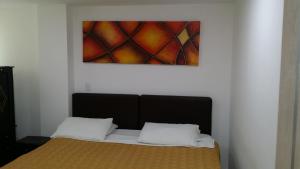 Postel nebo postele na pokoji v ubytování A Bogota On Holidays by Open - HOTEL CAS-EMBAJADA AMERICANA