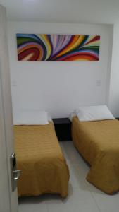 Postel nebo postele na pokoji v ubytování A Bogota On Holidays by Open - HOTEL CAS-EMBAJADA AMERICANA