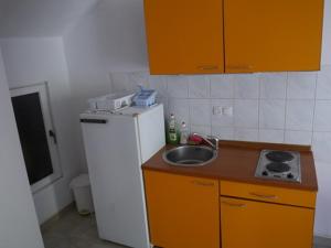 Kuchyň nebo kuchyňský kout v ubytování Apartment Dragovic