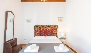 Villa Patmos Netia tesisinde bir odada yatak veya yataklar