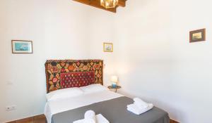 A bed or beds in a room at Villa Patmos Netia