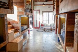 a room with wooden floors and wooden walls at PodShare Los Feliz in Los Angeles