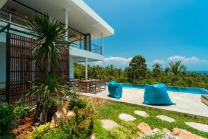 an image of a house with a swimming pool at Villa Tosti in Ban Bang Po