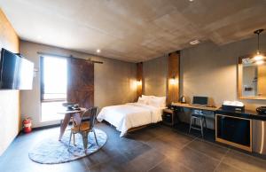 Kuchyň nebo kuchyňský kout v ubytování Boutique Hotel XYM Pyeongtaek