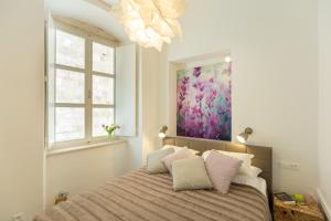 Säng eller sängar i ett rum på Apartment Hedera A2