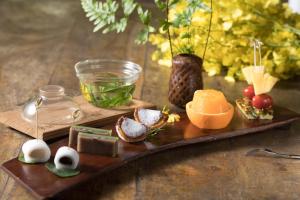 a wooden tray with different types of food on it at 逢春園Feng Chun Villa in Datong