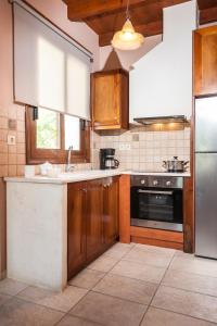 Kuchyň nebo kuchyňský kout v ubytování My Villa Dafni