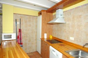 a kitchen with a sink and a counter top at Casa Cami Real in Villafranca del Cid