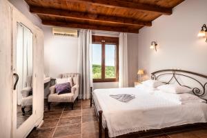 Postel nebo postele na pokoji v ubytování My Villa Dafni