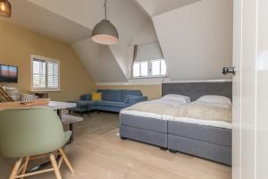 Posezení v ubytování De Herberg Appartementen