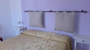 Voodi või voodid majutusasutuse Hotel Paese Corvara toas