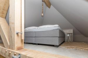 Postel nebo postele na pokoji v ubytování De Herberg Appartementen