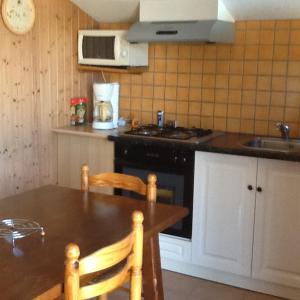 Köök või kööginurk majutusasutuses Le bois ramé