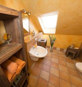 a bathroom with a sink and a toilet and a window at Wildnisresidenz am Nationalpark in Lindberg +58 photos
