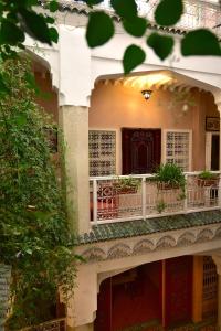 an external view of a building with a balcony at Riad Manissa in Marrakesh
