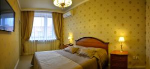 Кровать или кровати в номере Бутик-отель «Мегаполис»