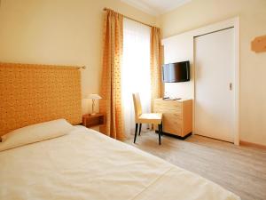 Postelja oz. postelje v sobi nastanitve Hotel Garni Golf