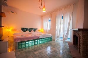 Letto o letti in una camera di Suite House L'Isola Che Non C'è