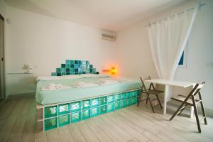 Letto o letti in una camera di Suite House L'Isola Che Non C'è