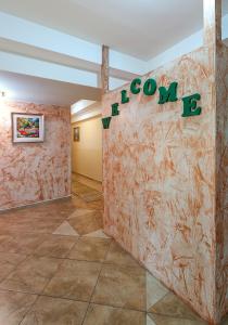 a room with a wall with a sign that reads room b at Green Center Gili in Gostivar