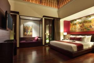 Ein Bett oder Betten in einem Zimmer der Unterkunft Mahagiri Villas Sanur