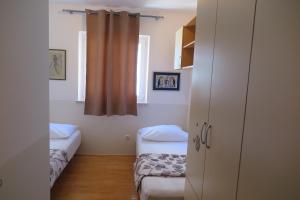 Postel nebo postele na pokoji v ubytování Apartments Kovacic