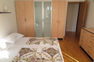 Postel nebo postele na pokoji v ubytování Apartments Kovacic