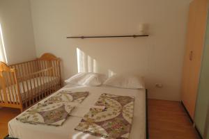 Postel nebo postele na pokoji v ubytování Apartments Kovacic