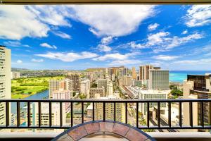 a view of the city from a balcony at Central Waikiki Luxury Penthouse in Honolulu