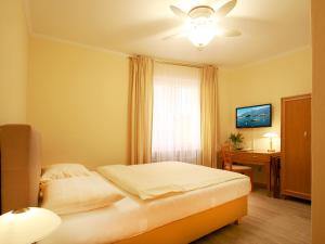 Postelja oz. postelje v sobi nastanitve Hotel Garni Golf