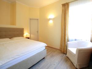 Postelja oz. postelje v sobi nastanitve Hotel Garni Golf