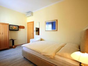 Postelja oz. postelje v sobi nastanitve Hotel Garni Golf
