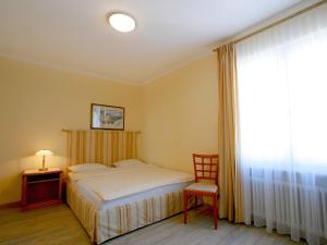 Postelja oz. postelje v sobi nastanitve Hotel Garni Golf