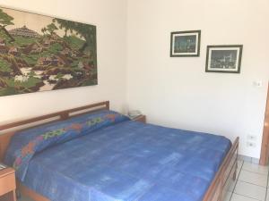 A bed or beds in a room at LungoMare Apartment
