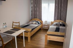 A bed or beds in a room at Pension König