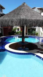 The swimming pool at or close to Apartamento Recanto dos Golfinhos