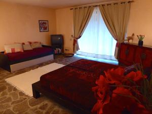 Postel nebo postele na pokoji v ubytování Bed Breakfast La Paggeria