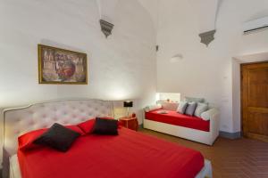 A bed or beds in a room at Residenza d'Epoca Galleria dell'Accademia