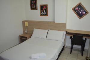 Postel nebo postele na pokoji v ubytování Hotel Elimar