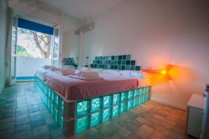 Letto o letti in una camera di Suite House L'Isola Che Non C'è