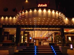 a building with a bunch of lights on it at Al Rest Inn Hotel in Jazan