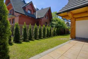 Vonkajšia záhrada v ubytovaní Apartament Tatrzański Raj 2