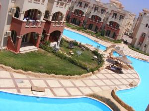 an aerial view of a resort with two swimming pools at La Sirena Hotel & Resort - Families only in Ain Sokhna