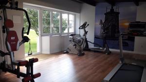a room with a gym with exercise equipment and a window at Casa de Castro in Cartavio