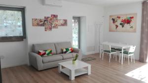 a living room with a couch and a table at I Colori di Mag in La Spezia