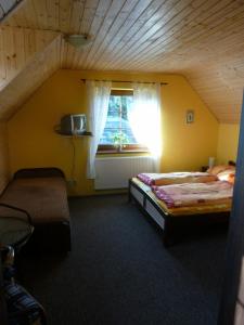 Postel nebo postele na pokoji v ubytování Apartmány Černá Voda