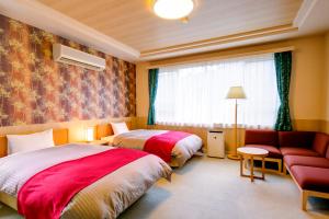 Llit o llits en una habitació de Sundance Resort Hakone Gora