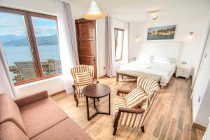 Postel nebo postele na pokoji v ubytování Forte Rose Hotel