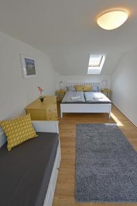 Postel nebo postele na pokoji v ubytování Apartmany Dolni Dunajovice