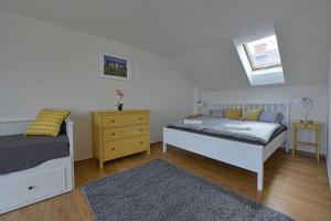 Postel nebo postele na pokoji v ubytování Apartmany Dolni Dunajovice